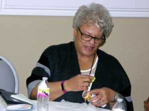 Attendee making baton