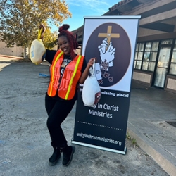 Volunteer holding turkeys