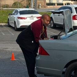 Pastor delivering food box