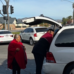 Pastor delivering food box