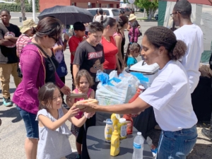 Selena serving up hotdogs
